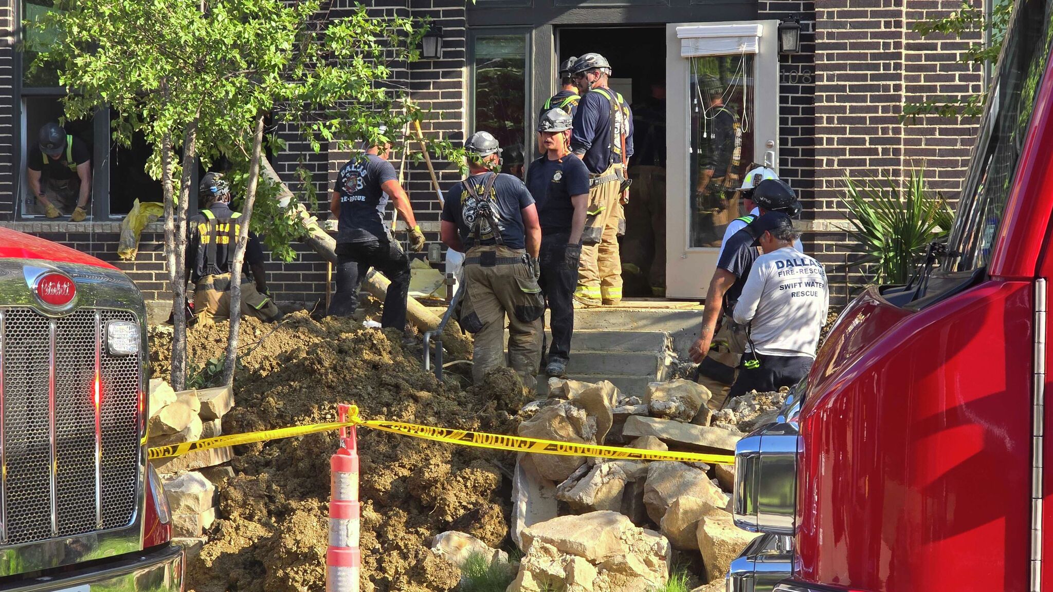 Emergency crews working to rescue worker from collapsed tunnel at apartment near Coppell - Dallas News